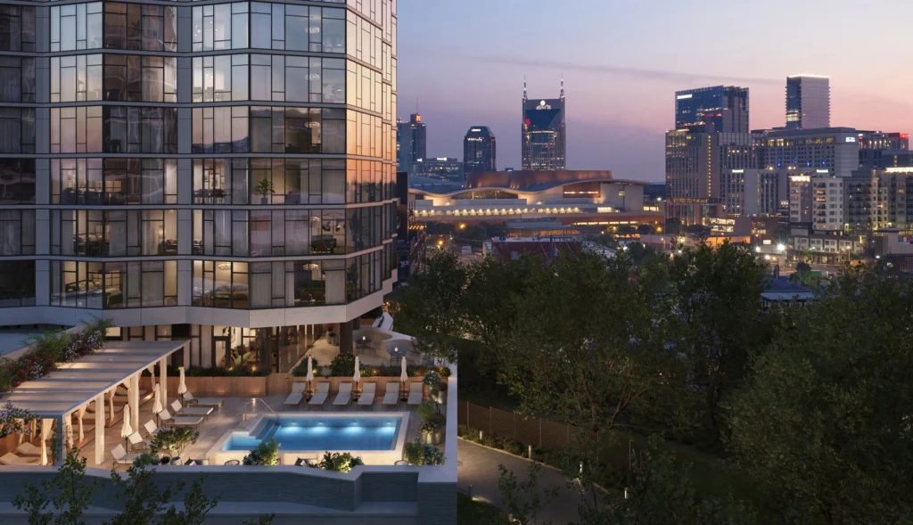 Exterior of Pendry Residences and pool deck at dusk: Luxury downtown Nashville condos for sale with city skyline views.