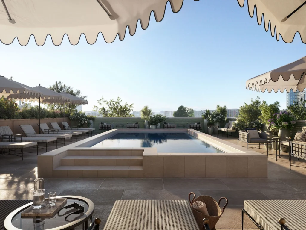 Rooftop pool deck and lounge area with views of downtown Nashville: an owner-only amenity at Pendry Nashville Luxury Condos.